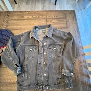 Black faded- washed, over- sized denim jacket.  Medium